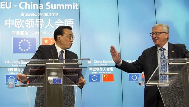 China's Premier Li Keqiang left and European Commission President Jean Claude Juncker participate in a media conference at an EU-China Summit at the European Council building in Brussels on Monday