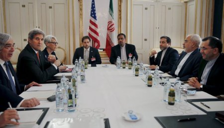 U.S. Secretary of Energy Ernest Moniz U.S. Secretary of State John Kerry and U.S. Under Secretary for Political Affairs Wendy Sherman meet with Iranian Foreign Minister Mohammad Javad Zarif at a hotel in Vienna Austria