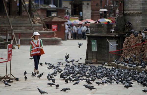 All rights reserved. A foreign delegate walks at the Basantapur Durbar Square heritage site in Kathmandu Nepal Wednesday