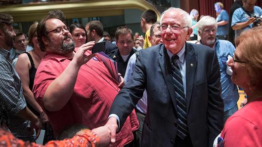 Democratic presidential hopeful Sen. Bernie Sanders greets guests at Drake University