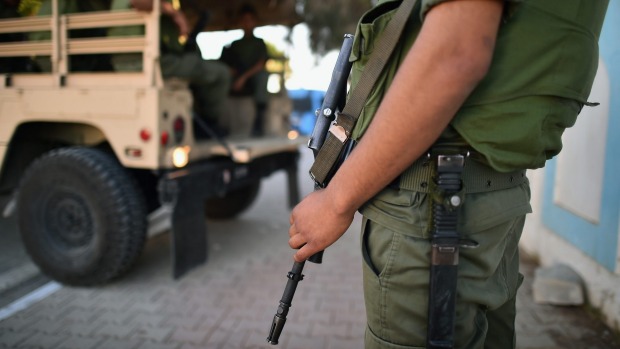 Soldiers stand guard near the Imperial Marhaba Hotel where 39 people were killed on Friday