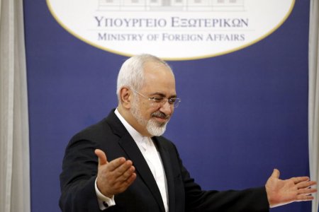 Iranian Foreign Minister Mohammad Javad Zarif gestures after a joint news conference with his Greek counterpart Nikos Kotzias in Athens