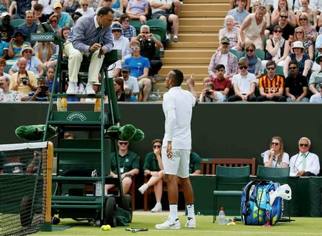 Nick Kyrgios of Australia talks to the umpire during his match against Diego Schwartzman of Argentina at the Wimbledon Tennis Championships in London today