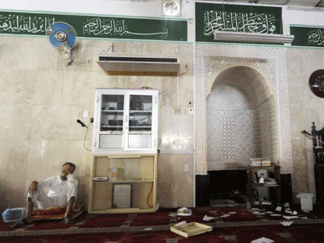 A Saudi man reacts following a suicide blast inside a mosque in the Saudi town of Qatif 400 kms east of Riyadh