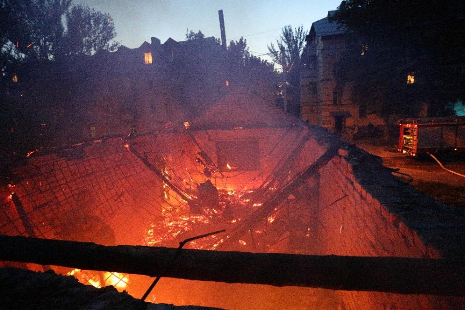 A building burns after shelling between Ukrainian forces and pro Russian separatists in the eastern Ukrainian city of Donetsk