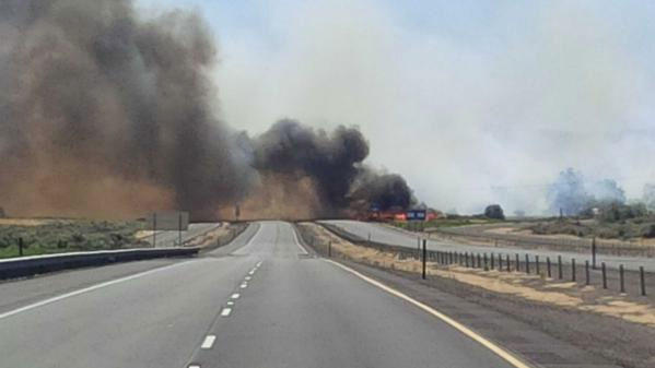 A fire jumped across Interstate 90 near George Washington Monday