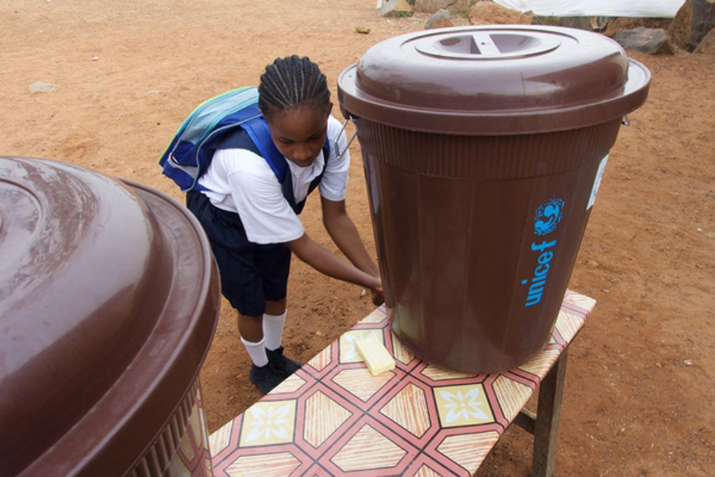 A girl washes her hands at the Slipway primary school in central Monrovia the capital of Liberia. March 2015