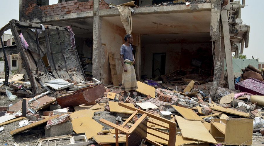 A man stands in front of a house destroyed by a Saudi-led air strike in Yemen's western city of Mokha