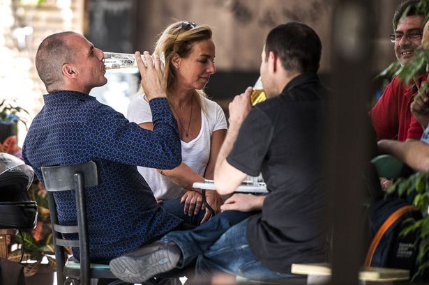 AGF s.r.l./REX Shutterstock

Drinking it up Varoufakis was seen enjoying a beer with wife Danae Stratou