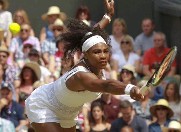 Serena Williams returns a shot to Garbine Muguruza during the women's singles final at the All England Lawn Tennis Championships in Wimbledon