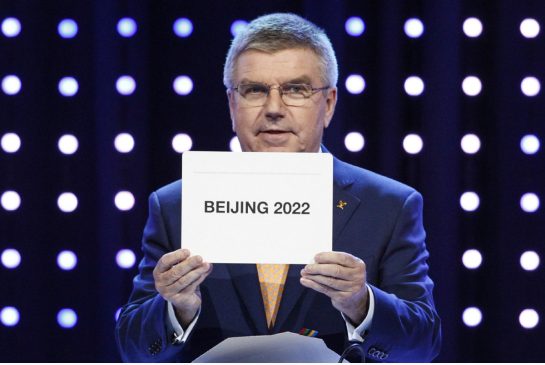 President of the International Olympic Committee Thomas Bach opens the envelope announcing that Beijing has won the bid to host the 2022 Winter Olympic Games at the 128th International Olympic Committee session in Kuala Lumpur Malaysia Friday