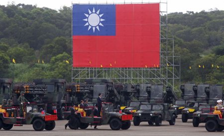 Taiwan President Ma Ying-jeou inspects military vehicles during the annual Han Kuang military exercise in an army base in Hsinchu northern Taiwan