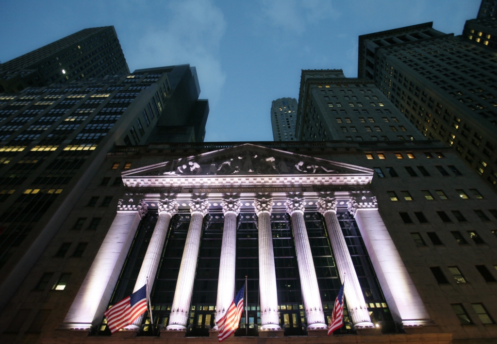 American flags fly in front of the New York Stock Exchange. Asian stock markets were rattled Friday