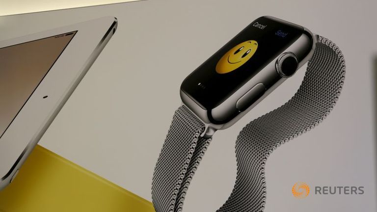 An image of an Apple Watch is shown on a wall at its retail store in San Francisco California