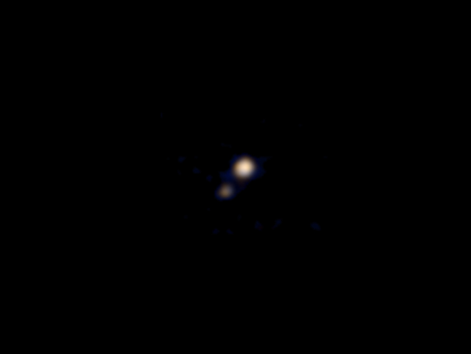 The first color image of Pluto taken by the New Horizons spacecraft on approach