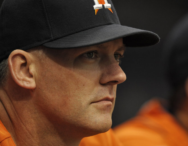 Houston Astros manager A.J. Hinch watches his team play the Tampa Bay Rays during the first inning of a baseball game Sunday