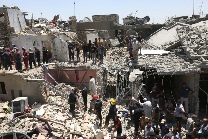 Iraqi security forces search for survivors after a bombing attack in the eastern neighborhood of New Baghdad. Iraq Monday