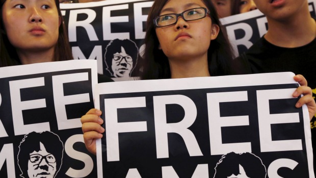 Students demanding the release of Singaporean teenager Amos Yee protest outside the Singapore Consulate in Hong Kong