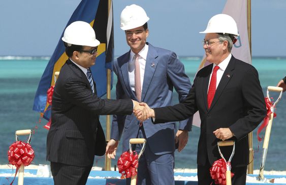 Baha Mar Resorts CEO Sarkis Izmirlian center stands between Export Import Bank of China President Li Ruogu left and Bahama's Deputy Prime Minister Brent Symonette during the groundbreaking ceremony for