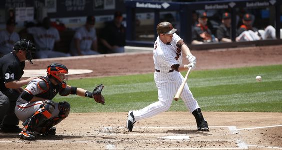 Jedd Gyorko launches a long home run into the left field seats against the San Francisco Giants in the second inning of a baseball game Wednesday