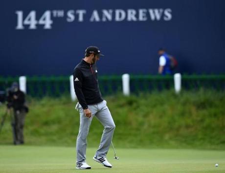 US golfer Dustin Johnson looks at his ball on the 18th green during his third round 75 on day four of the 2015 British Open Golf Championship on The Old Course at St Andrews in Scotland