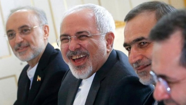 Iranian Foreign Minister Javad Zarif enjoys a lighter moment at the start of a meeting with US Secretary of State in Vienna Austria