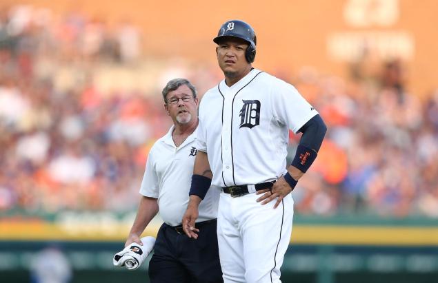 Miguel Cabrera of the Tigers leaves the game with trainer Kevin Rand during the fourth inning of the game against the Blue Jays on Friday