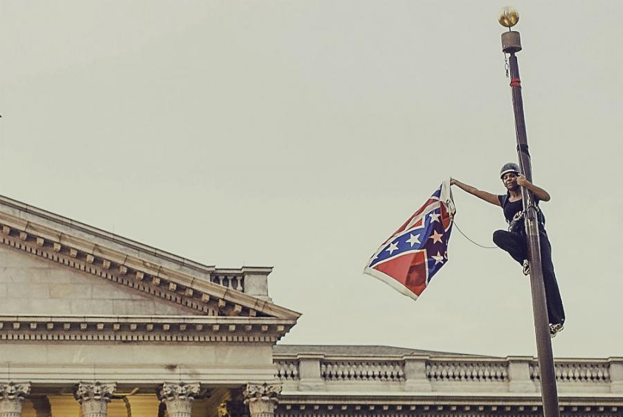 Bree Newsome takes down the flag. Reuters Media Express  Adam Anderson