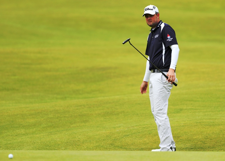 Australia’s Marc Leishman who lives in Virginia Beach watches his putt on the 18th green during the third round at the British Open on Sunday