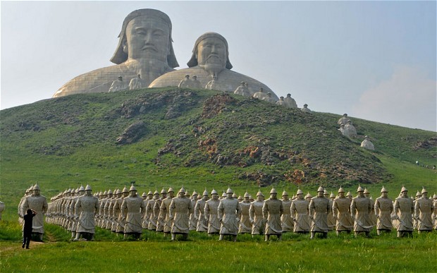 Terracotta Mongolian Warriors and a statue of Genghis Khan are seen at the recently completed Mount Khan tourist attraction in Holingol Inner Mongolia