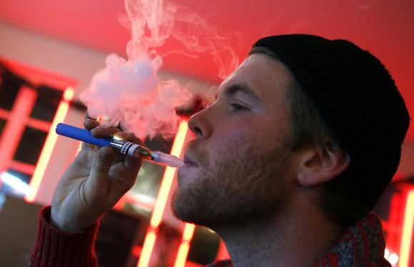 CREDIT REUTERS  MIKE SEGAR  FILESA customer puffs on an e-cigarette at the Henley Vaporium in New York City in this