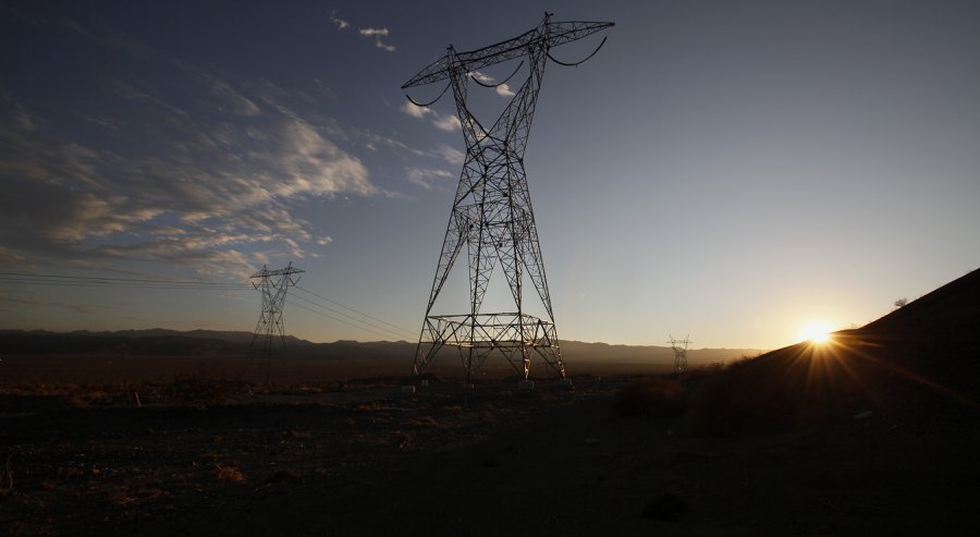 Near Plaster City workers busily construct a transmission tower. A 117-mile electron highway leading into the desert the Sunrise Powerlink means more green energy for San Diego as well as bumper profits for the local utility at a significant price to C