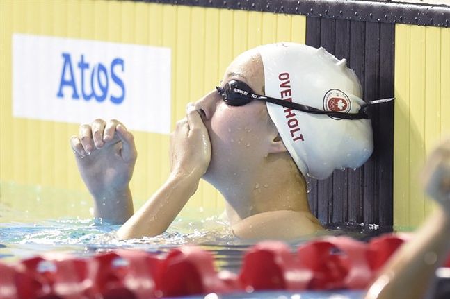 Emily Overholt reacts after finishing the women's 400m individual medley final swimming event at the 2015 Pan Am Games in Toronto on Thursday