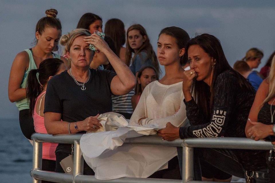 Lanterns at vigil a beacon of hope for missing boaters