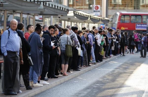 Commuters queue for buses as tube drivers are