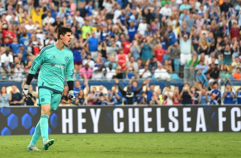 Chelsea goalkeeper Thibaut Courtois reacts after scoring the winning goal during a penalty shootout against PSG at an International Champions Cup football match in Charlotte North Carolina