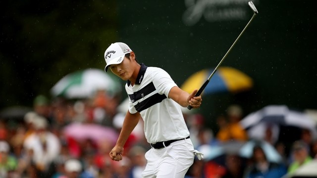 New Zealand golf No 1 Danny Lee lifts the trophy for his victory on the PGA Tour at the Greenbrier Classic