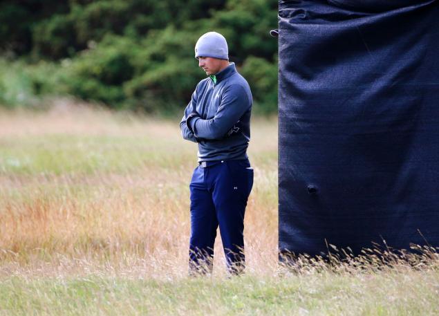 Jordan Spieth waits for play to resume on the 14th hole during the second round of the British Open Golf Championship