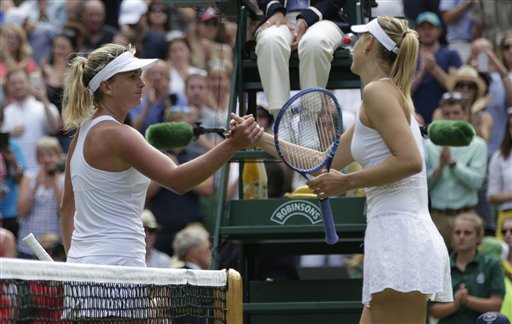 Maria Sharapova of Russia right shakes hands at the net Coco Vandeweghe of the United States after winning their singles match at the All England Lawn Tennis Championships in Wimbledon London Tuesday