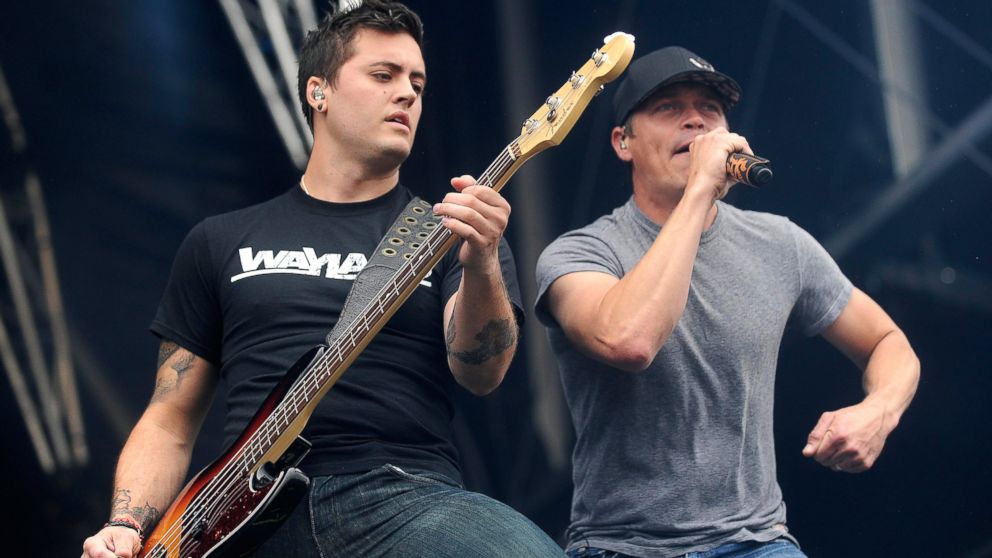 Rock singer Brad Arnold of 3 Doors Down right performs on stage with bass player Justin Biltonen during the Hellfest Heavy Music Festival