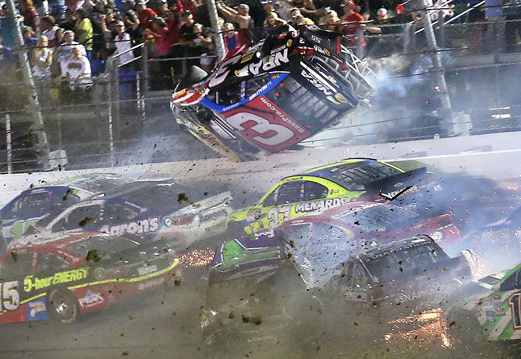 Austin Dillon goes airborne as he was involved in a multicar crash on the final lap of the NASCAR Sprint Cup series auto race at Daytona International Speedway Monday