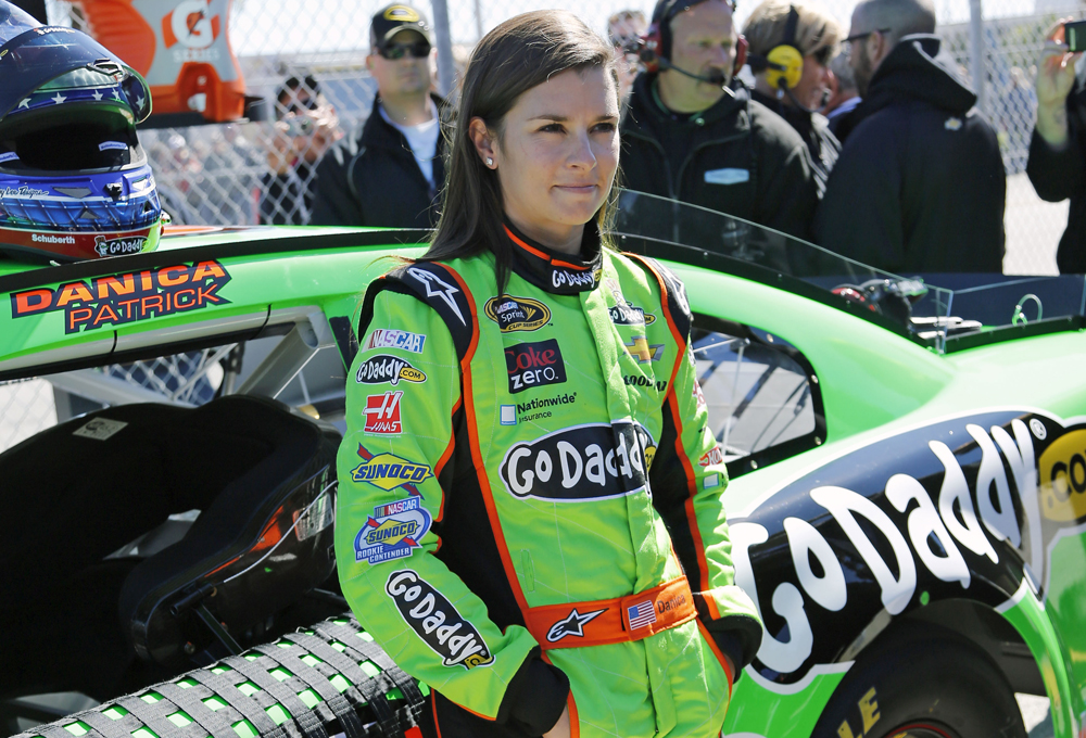 Danica Patrick stands by her car on pit road after qualifying for the NASCAR Daytona 500 Sprint Cup Series auto race at Daytona International Speedway Sunday Feb. 17 2013 in Daytona Beach Fla. Patrick won the pole becoming the first woman to secure