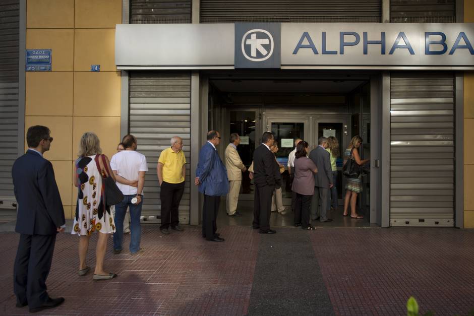 1/1


Emilio Morenatti  AP
People line up to withdraw cash from a bank machine in central Athens Wednesday