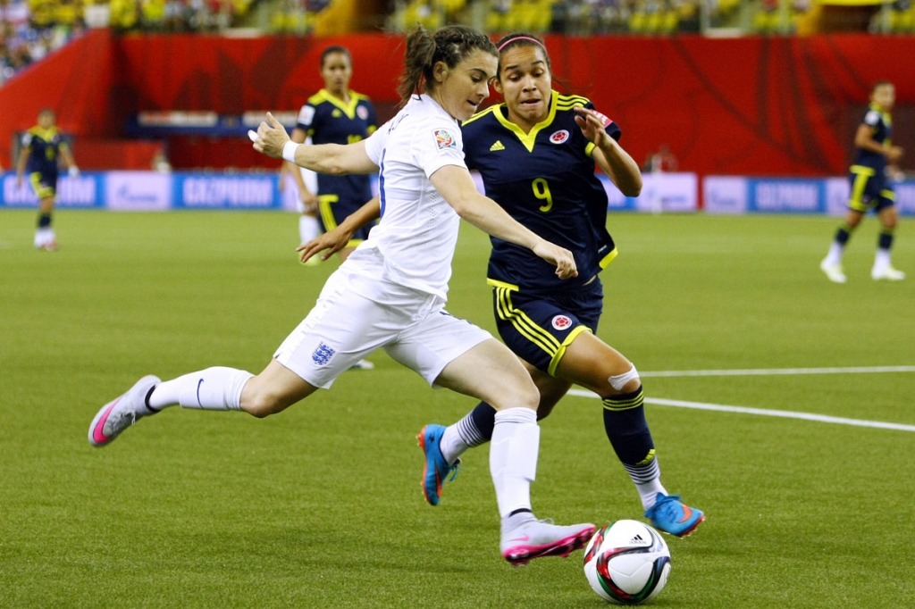 England's Karen Carney and Colombia's Orianica Velasquez battle for the ball