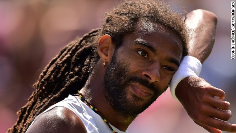 Feeling the heat Germany's Dustin Brown on his way to a third round defeat to Viktor Troicki of Serbia at Wimbledon