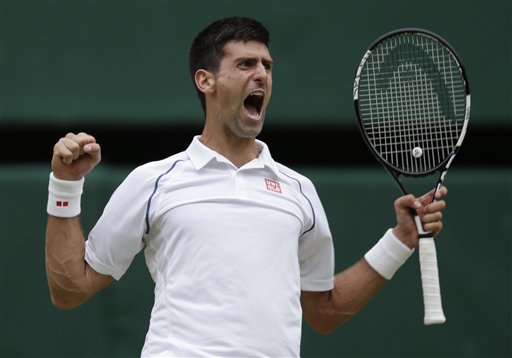 Novak Djokovic of Serbia celebrates winning the men's singles final against Roger Federer of Switzerland at the All England Lawn Tennis Championships in Wimbledon London Sunday