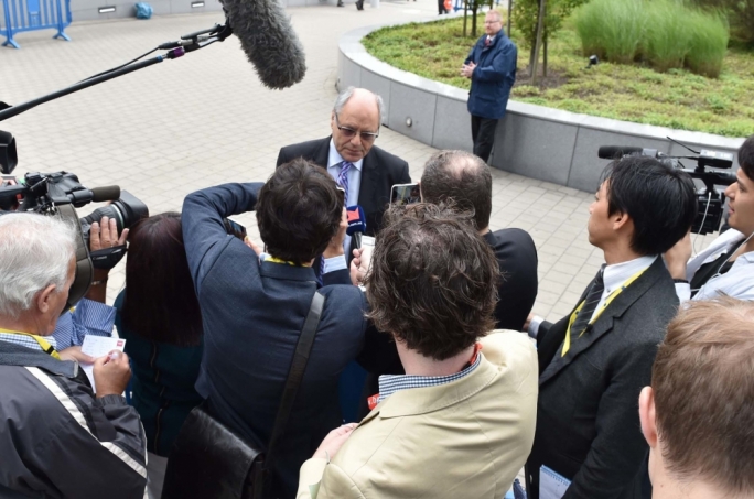 Finance Minister Edward Scicluna addressing reporters in Brussels