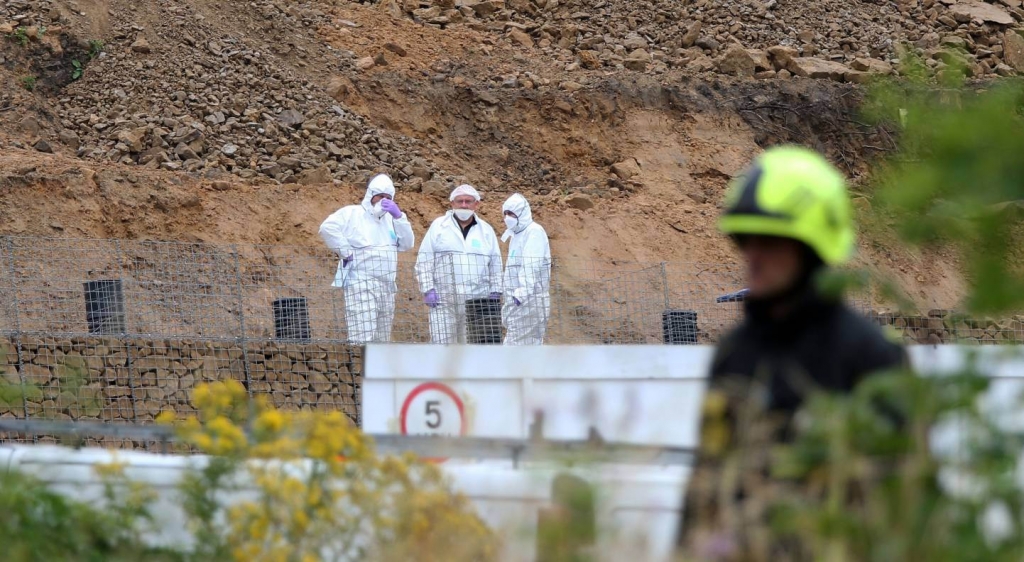 Forensic officers search a site in Barnsley