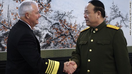 Former U.S. Pacific commander Adm. Timothy Keating shakes hand with General Guo Boxiong in 2008