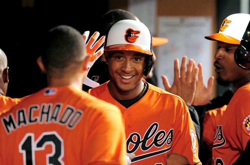 DETROIT MI- JUNE 25 J.B. Shuck #20 of the Chicago White Sox is congratulated in the dugout after scoring against the Detroit Tigers on a triple by Carlos Sanchez of the Chicago White Sox during the 10th inning at Comerica Park